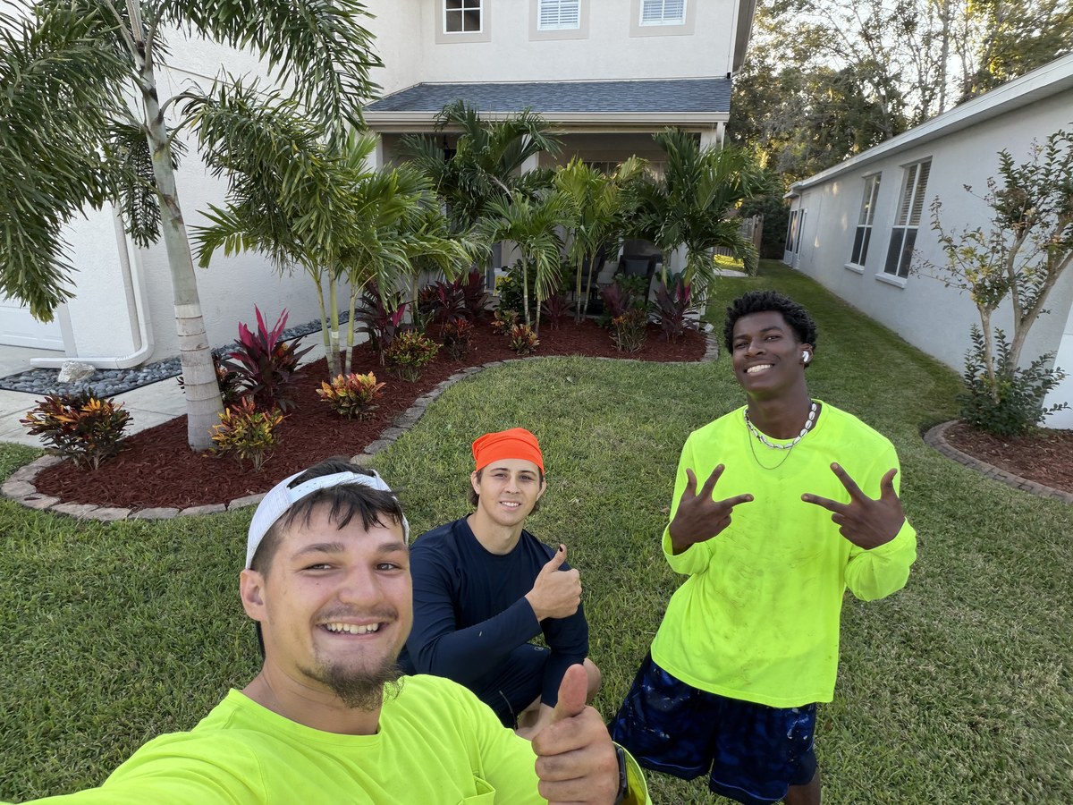 The Wells Landscaping and Home Service crew at a completed job in New Port Richey